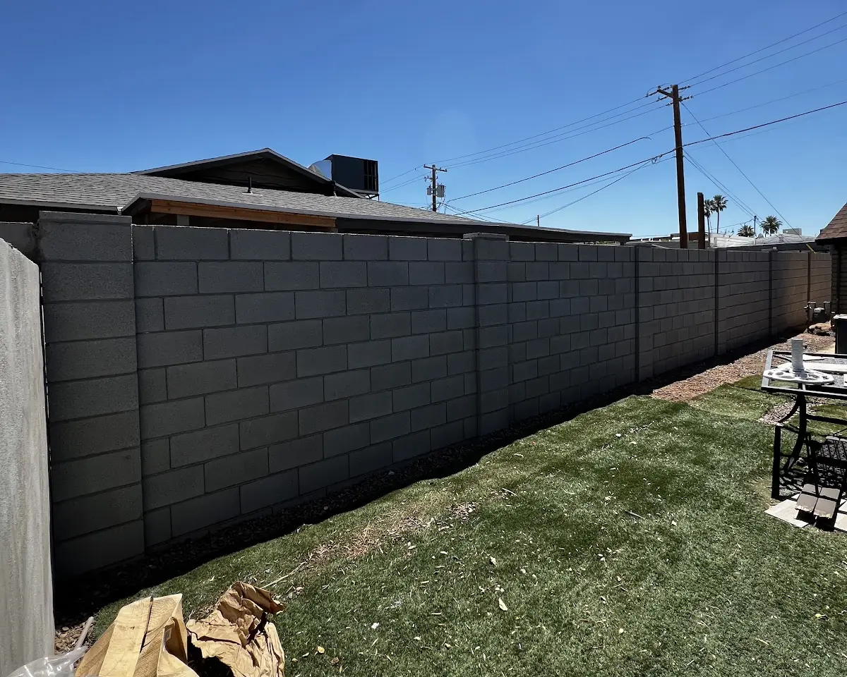 A new CMU block wall along a backyard, built by our featured contractor
